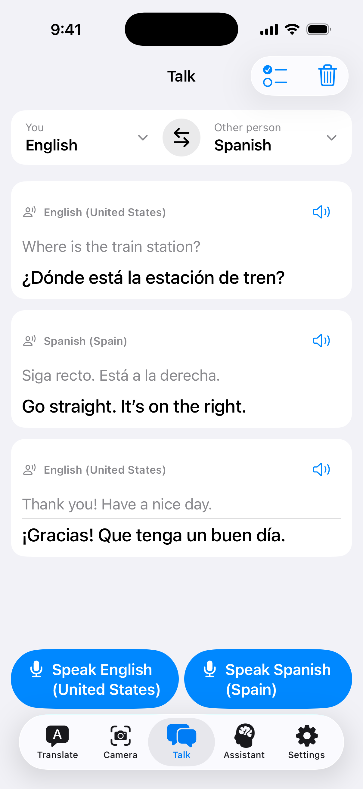 Offlinguo Talk showing three English–Spanish turns: asking for the station, receiving directions and saying thank you
